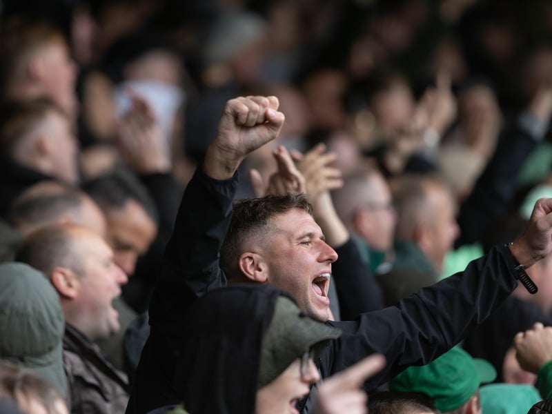 A Celtic supporter celebrates the team's 3-0 win over St Mirren.