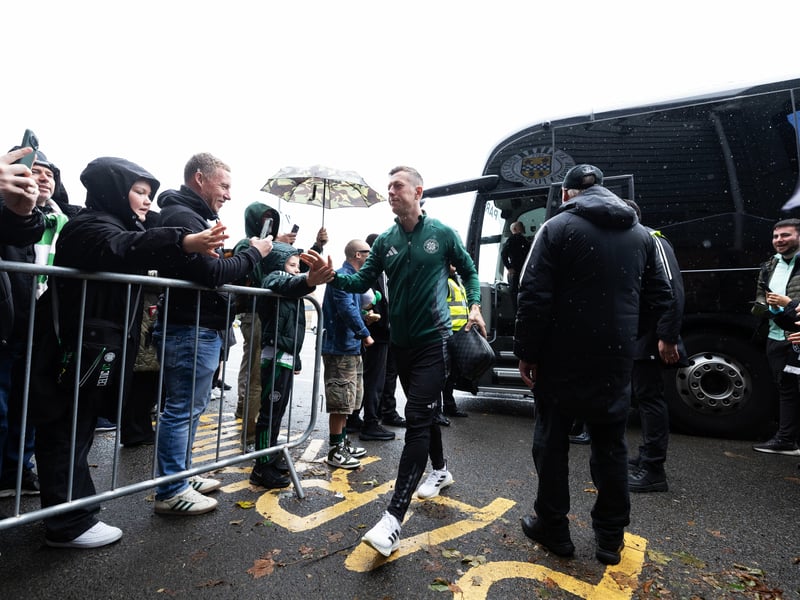 Callum McGregor is welcomed into the stadium by the Celts' away support.