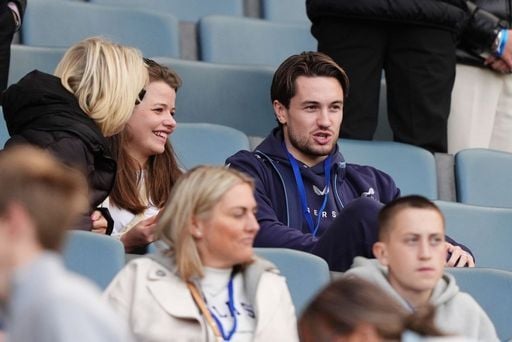 The injured Scott Wright takes in his side's 6-0 win.