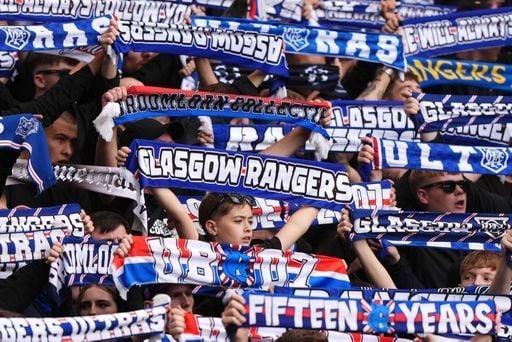 Rangers fans show their loyalty and raise their scarves during the 6-0 win at Hampden.
