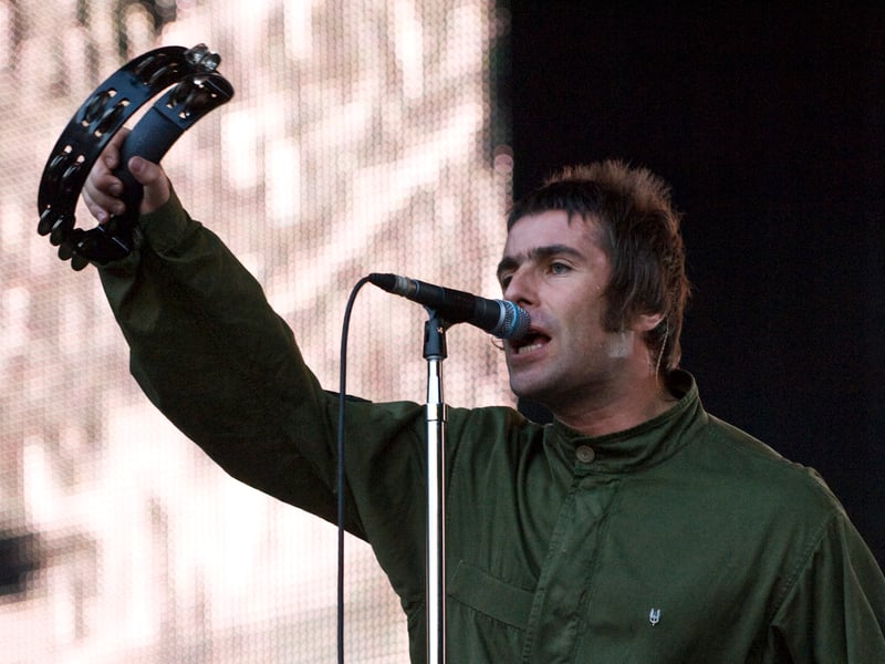 Liam Gallagher brandishes his tambourine.