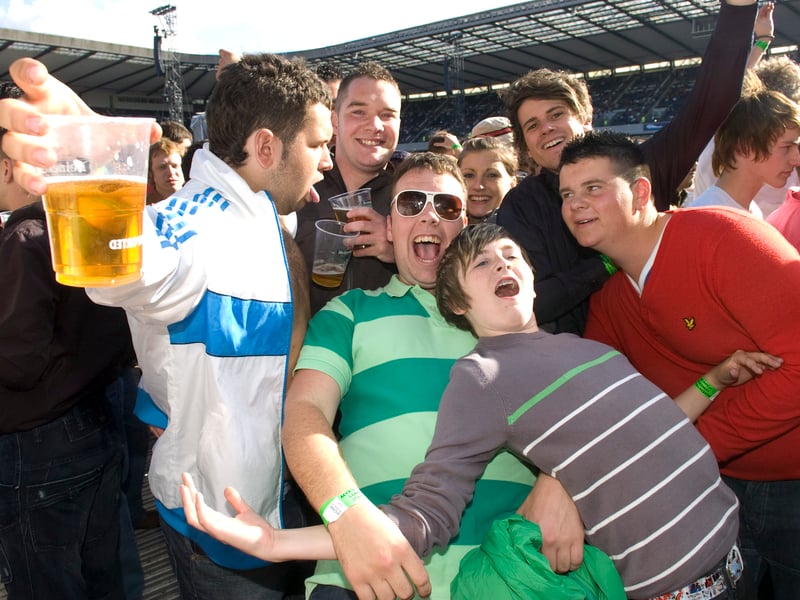 Fans prepare to welcome Oasis onto the Murrayfield stage.