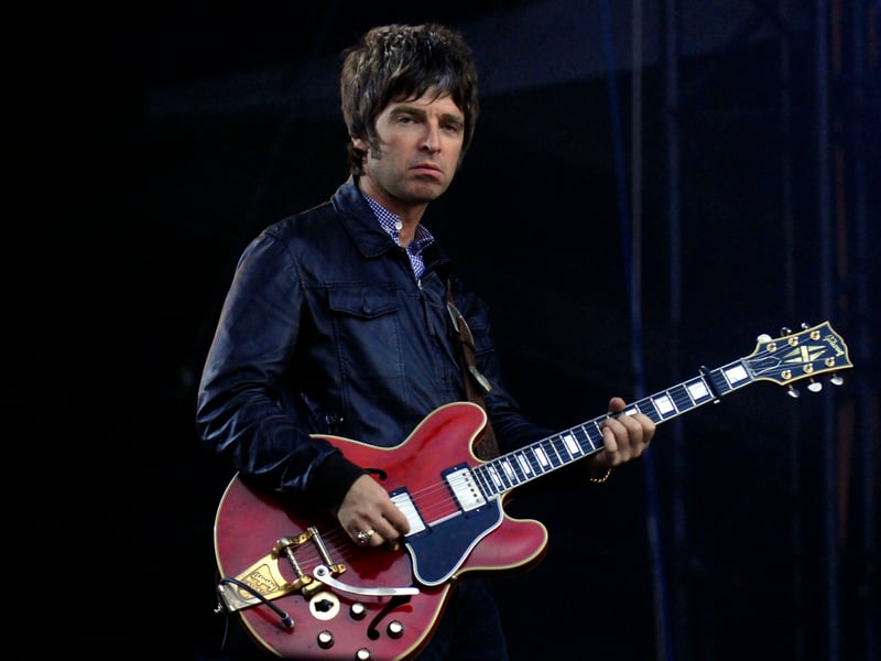 Noel Gallagher playing at the gig, which finished with 'Champagne Supernova' and Beatles cover 'I Am The Walrus'.