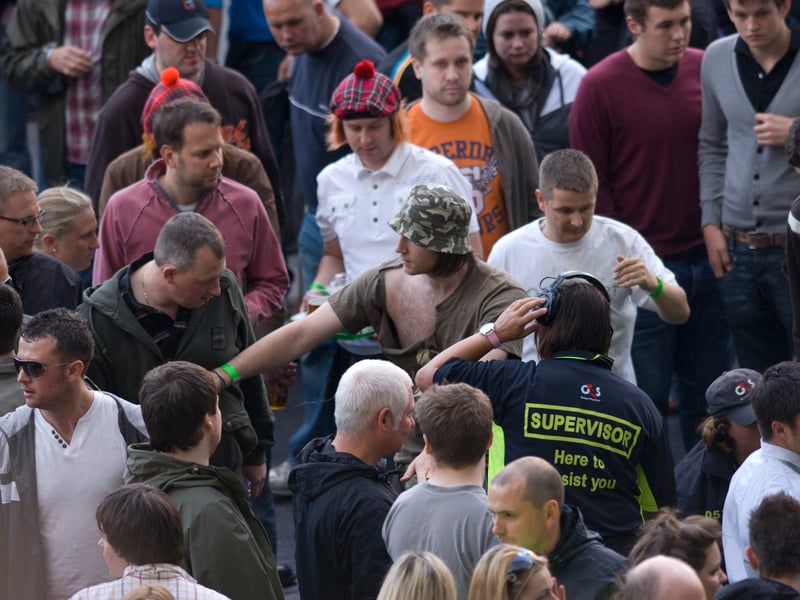 A fight breaks out in the crowd.