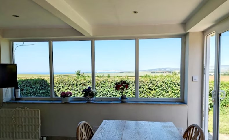 The listing says: "The ground floor accommodation briefly consists of a cosy living room, fabulous open plan kitchen/breakfast room, dining room, utility room, cloakroom / W.C and downstairs bedroom / additional living room."