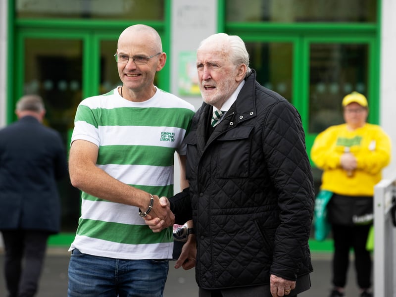 Celtic legend Danny McGrain shakes hands with a fan.