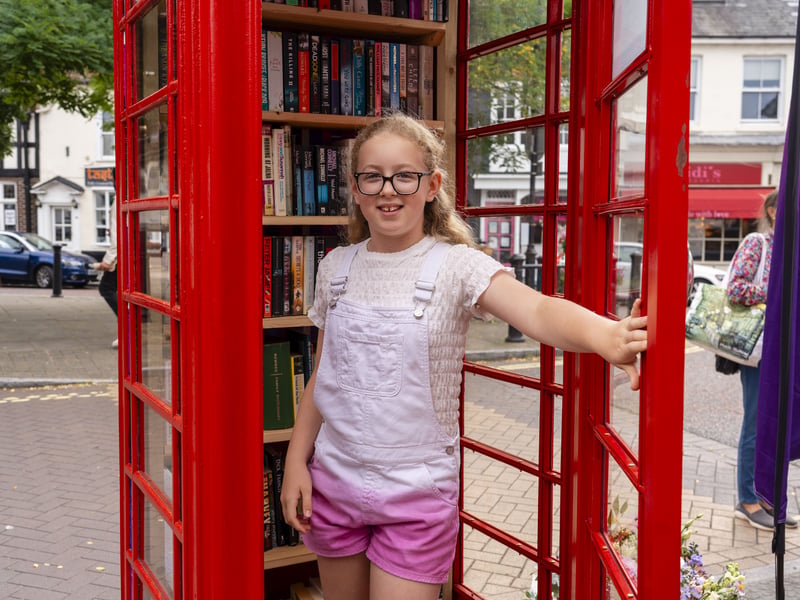 It's open! Hariot Turner enjoys the Booknook after officially opening it.