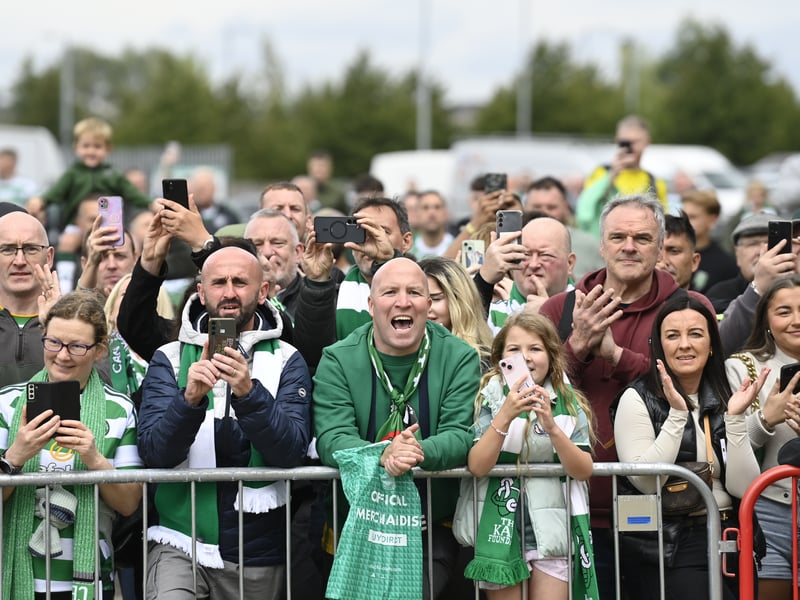 Supporters await the arrival of the Hoops team.
