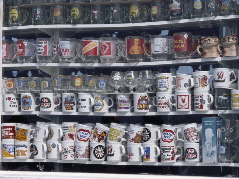 Novelty mugs on sale in a shop in the seaside town of Blackpool, Lancashire, August 1983