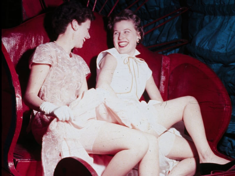 Two women enjoy the thrills of 'The Loveboat' ride in Blackpool