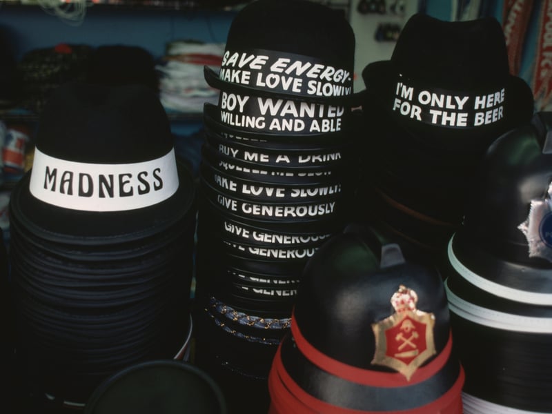 Souvenir novelty hats with the slogan kiss me quick, squeeze me slowly and 'I'm only here for the beer' are stacked up in a shop in the seaside resort of Blackpool, Lancashire, August 1983