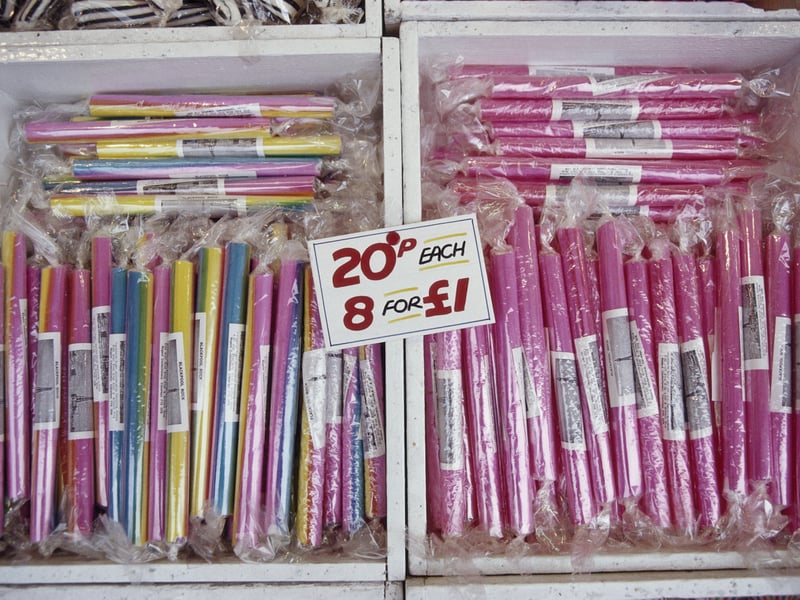 Brightly coloured sticks of rock on sale in the seaside town of Blackpool, Lancashire, April 1987