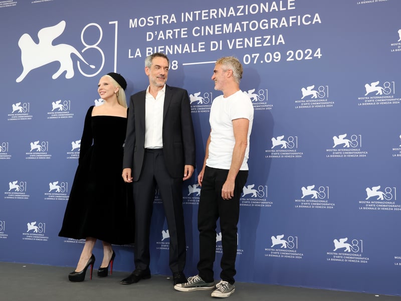 VENICE, ITALY - SEPTEMBER 04: Lady Gaga, Director Todd Phillips and Joaquin Phoenix attend the "Joker: Folie A Deux" photocall during the 81st Venice International Film Festival at Palazzo del Casino on September 04, 2024 in Venice, Italy. (Photo by Vittorio Zunino Celotto/Getty Images)