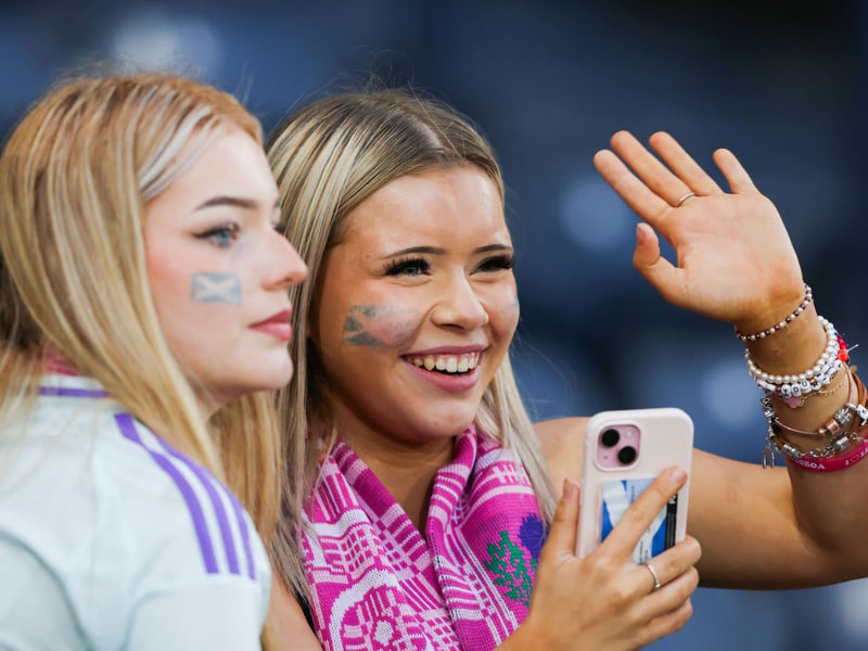 Two young Scotland fans prepare to cheer on Steve Clarke's side at Hampden Park.