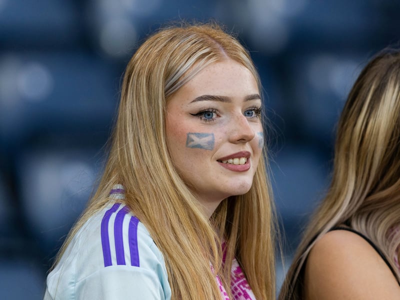 A young supporter backing her team with the customary facepaint.