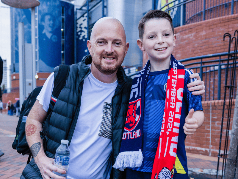 Two supporters are all smiles ahead of the Nations League clash against Poland.