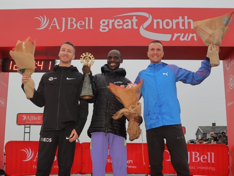 Abel Kipchumba wons the 2024 AJ Bell Great North Run Elite Men's Race with Marc Scott (left) in second and Sondre Moen (right) in third.