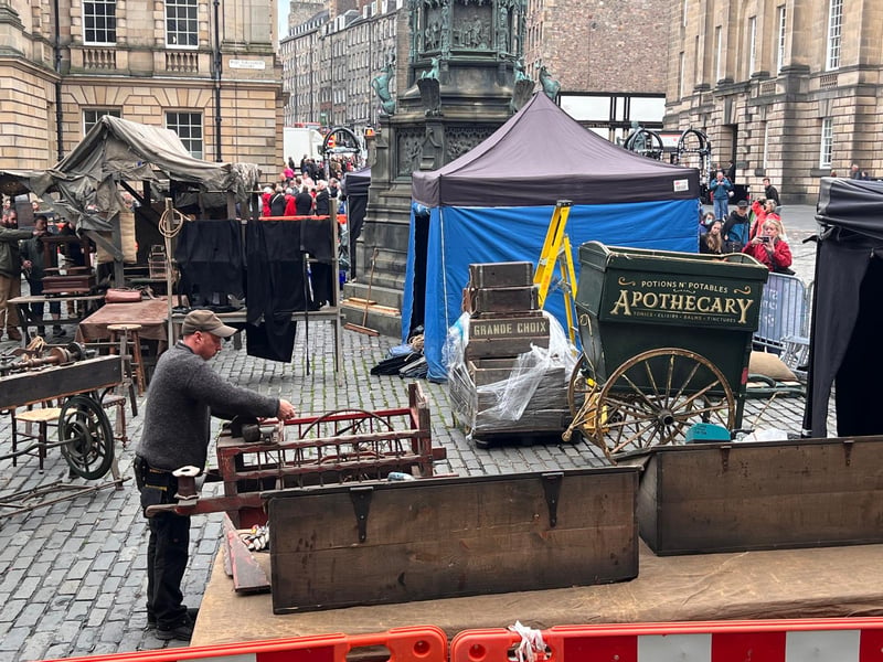 Film crews can be seen working on props for Frankenstein around Parliament Square in Edinburgh. 