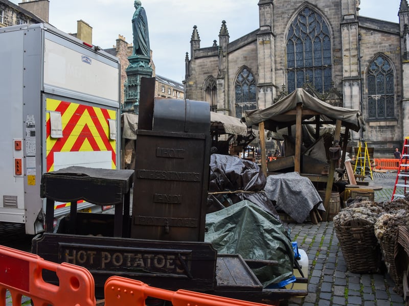 Period appropriate carts sit outside Edinburgh's St Giles' Cathedral. 