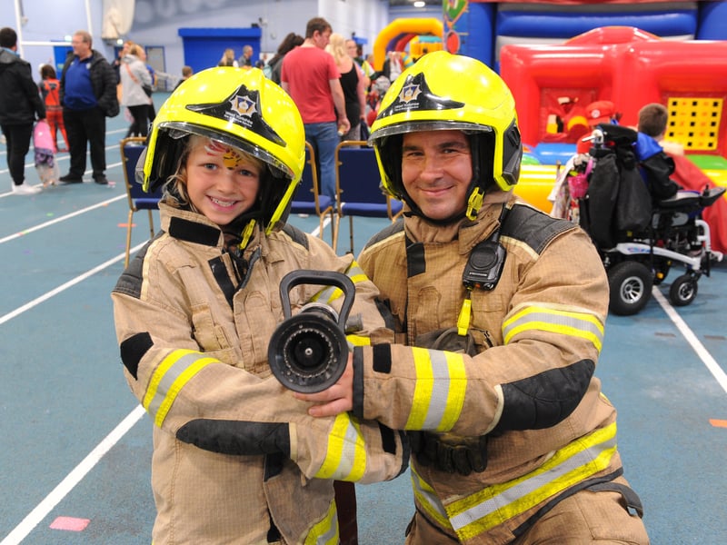 Charlie Owen, eight with firefighter Chris Mortimer of Hunslet fire station 