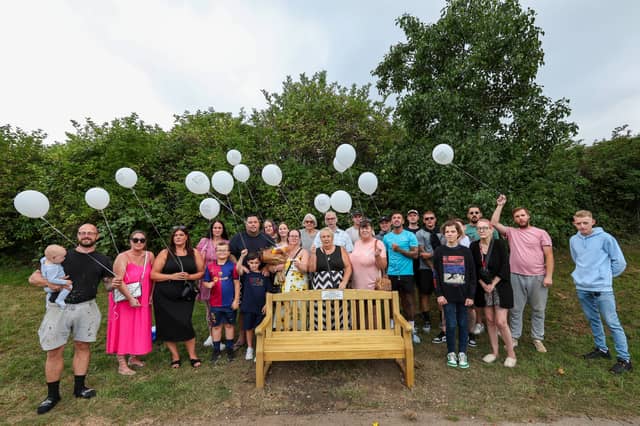Family and friends of Ian Lamb at the unveiling of a memorial bench in his honour near the shoreline at the Mountbatten Centre. Mr Lamb took his own life aged 31, and this bench was dedicated to him on the first anniversary of his death
Picture: Chris Moorhouse (140824-24)