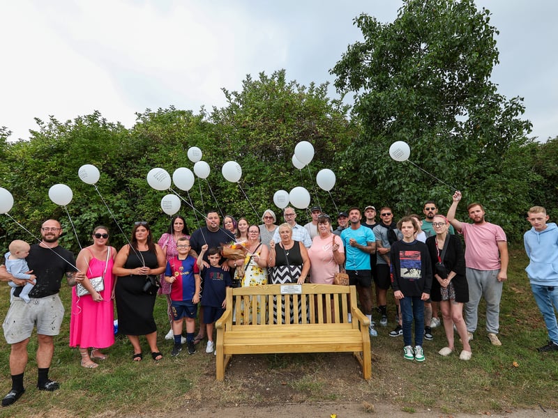 Family and friends of Ian Lamb at the unveiling of a memorial bench in his honour near the shoreline at the Mountbatten Centre. Mr Lamb took his own life aged 31, and this bench was dedicated to him on the first anniversary of his death
Picture: Chris Moorhouse (140824-24)