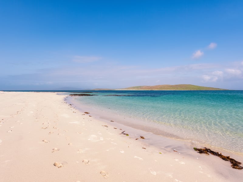 One of Scotland’s most remote beaches, Eoligarry Beach is secluded at the narrow north end of the Isle of Barra, at the tip of the Outer Hebrides. The white shell sands and turquoise water, coupled with huge Atlantic waves during stormier seasons, make it one of Scotland's best beaches.
