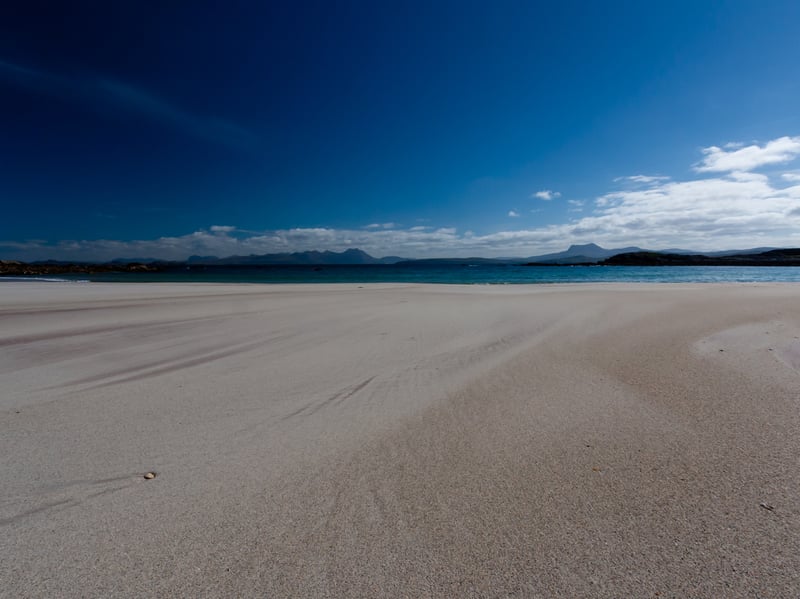 The small hamlet of Mellon Udrigle, is home to one of Scotland's best white sand beaches. In addition to its natural landscape, visitors can enjoy scenic views of Highland mountains or historical attractions, such as a hut circle which was constructed by the Picts.
