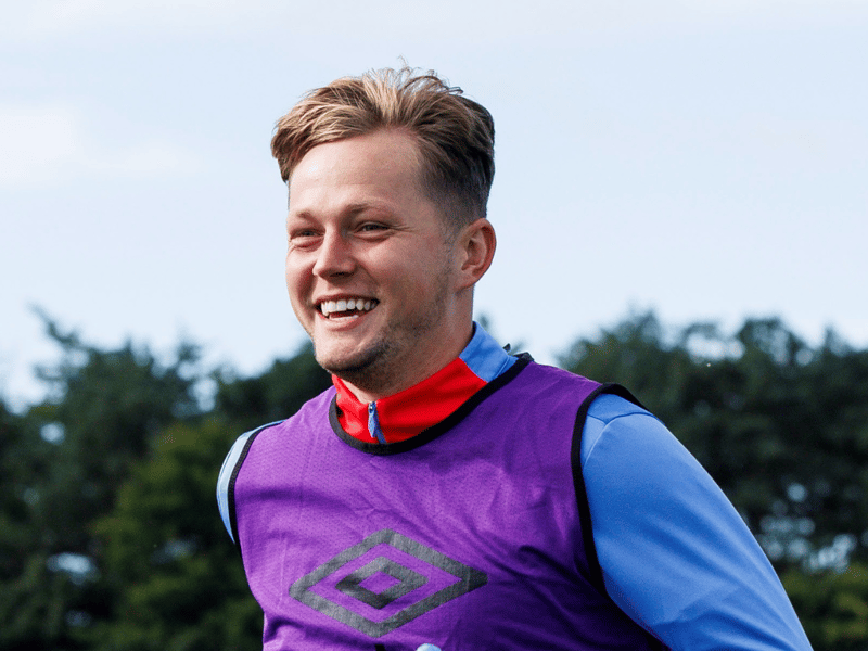 The English defender will start in the centre of defence at Celtic Park.