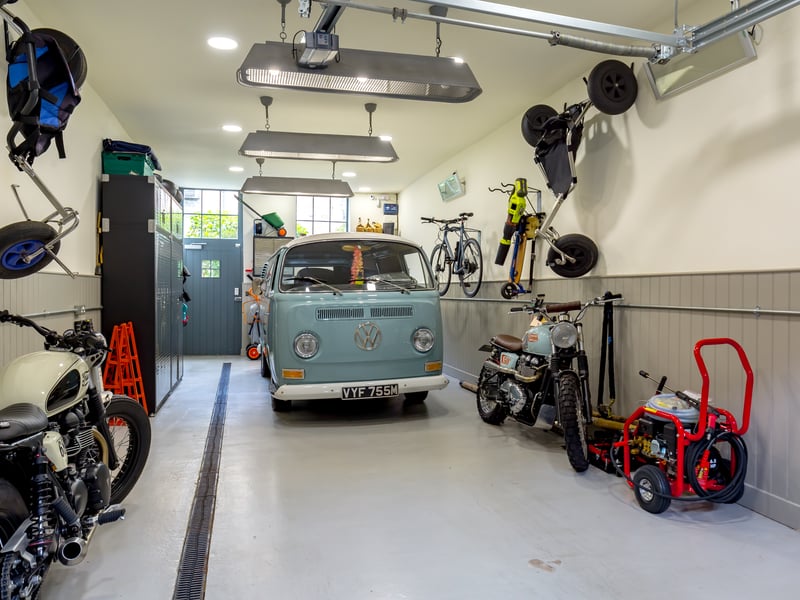 A large tandem garage situated on Gloucester Lane has direct access to the garden and the rear of the property.