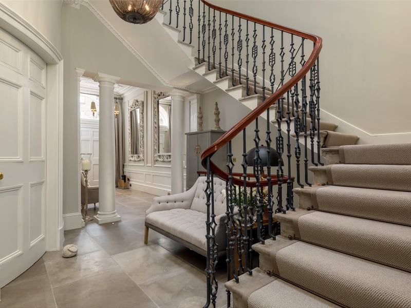 An elegant staircase leads you between the property's five levels.