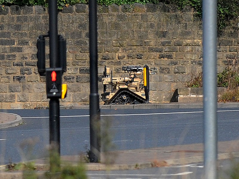 The army robot is deployed to the roundabout where a "suspicious package" was reported.