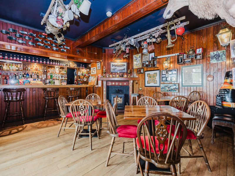 The hotel's comfortable wood-paneled bar.