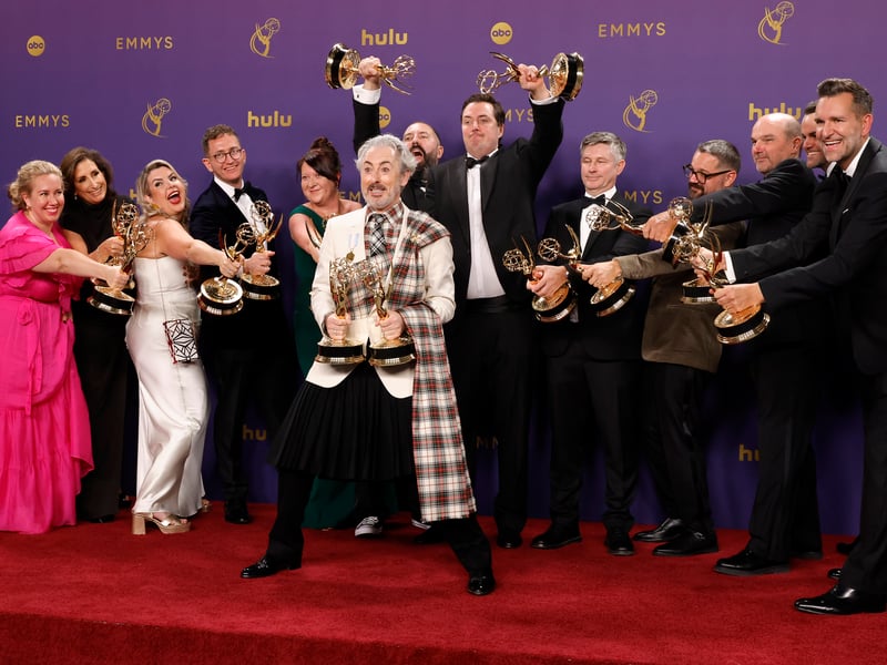Alan Cumming with the Cast and Crew of "The Traitors" pose in the press room after winning the Outstanding Reality Competition Program Award during the 76th Primetime Emmy Awards.