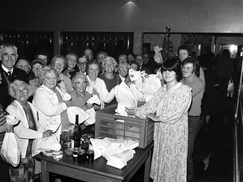 Students from Edinburgh's Napier College with Christmas food parcels for old age pensioners at Sighthill community centre in December 1978.
