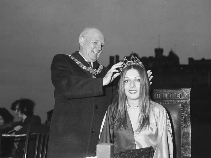Lord Provost Jack Kane crowns Edinburgh University Charities Queen Heather Paterson in a ceremony on Edinburgh Castle esplanade in April 1974.
