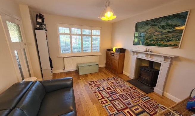 The listing says: "The property has been considerably improved by the present owners and includes 2 log burning stoves, a 23ft garage and extensive off road parking."