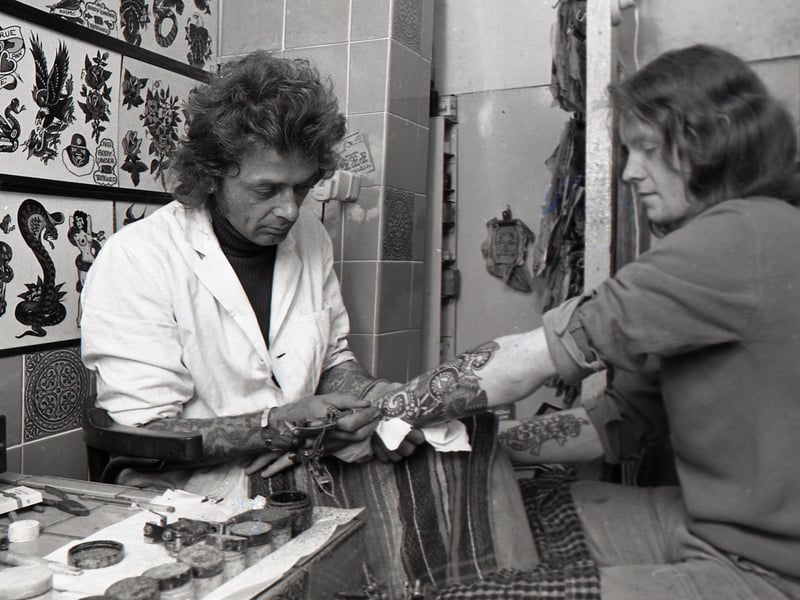 Blackpool tattoo expert Jimmy Gould needles more artistry on to the arm of 19-year-old Bill Leeming at his Blackpool studio