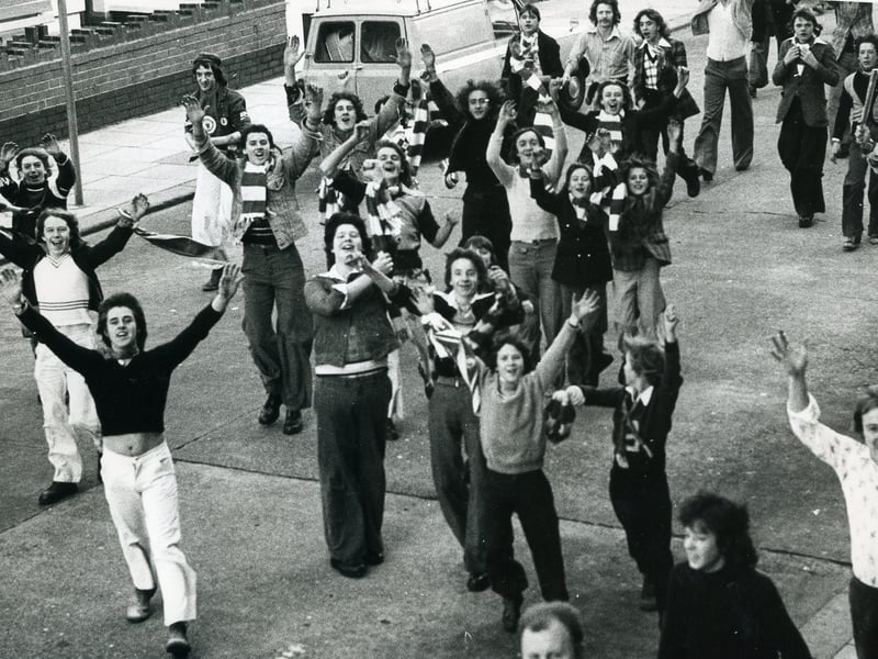 Manchester United Supporters streamed through the streets of Blackpool for the match at Bloomfield Road in October 1974.