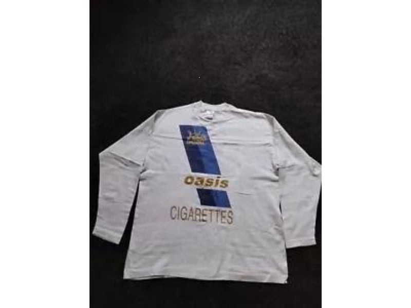 This Oasis t-shirt was released as part of the publicity campaign for the single 'Cigarettes and Alcohol'. Another item that came up for auction after the reunion was announced, it attracted 12 bids and achieved a selling price of £560.