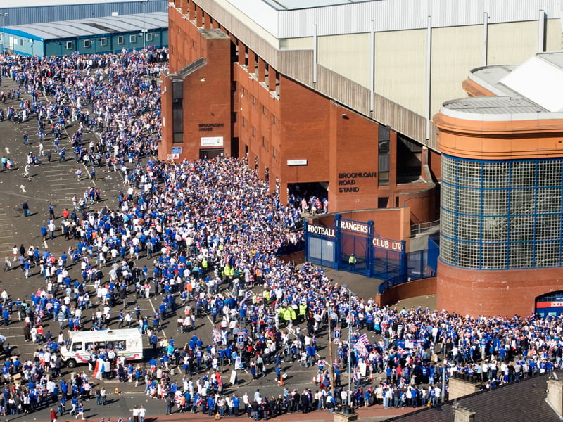 Rangers fans arrive early to ensure entry to Ibrox to watch the UEFA Cup Final live on a giant screen on the pitch in 2008.