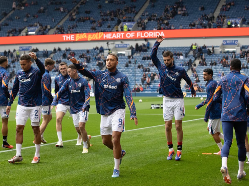 The Rangers players go through their warm-up routine ahead of kick-off against Dundee.