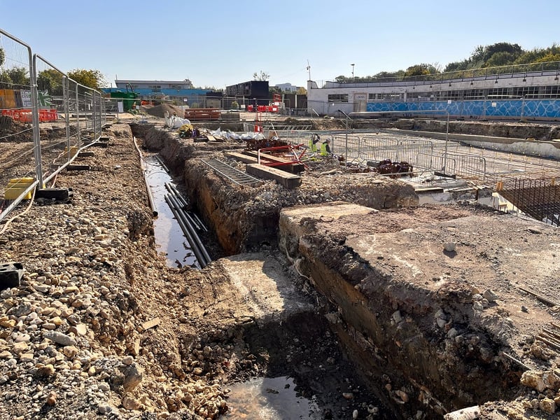 Portsmouth City Council has issued an update on the progress of Hilsea Lido.
Pictured: A dug out trench around the edge of the pool with the uncovered foundations of the old diving board.