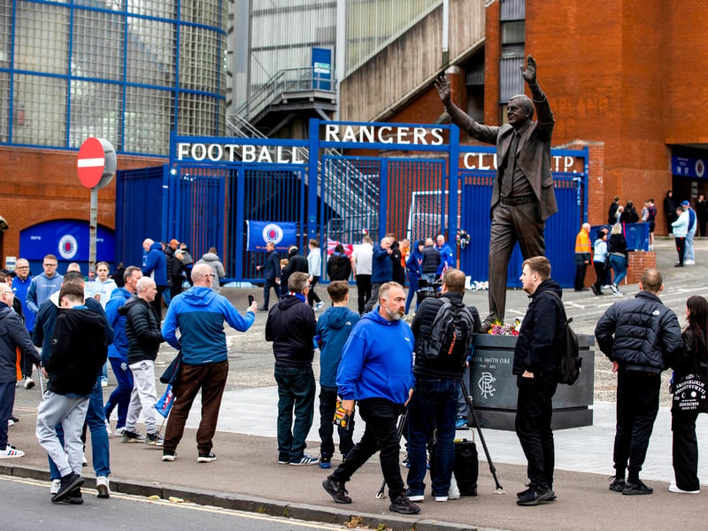 Rangers fans congregate around the Walter Smith statue as they arrive at Ibrox for the match against Dundee.