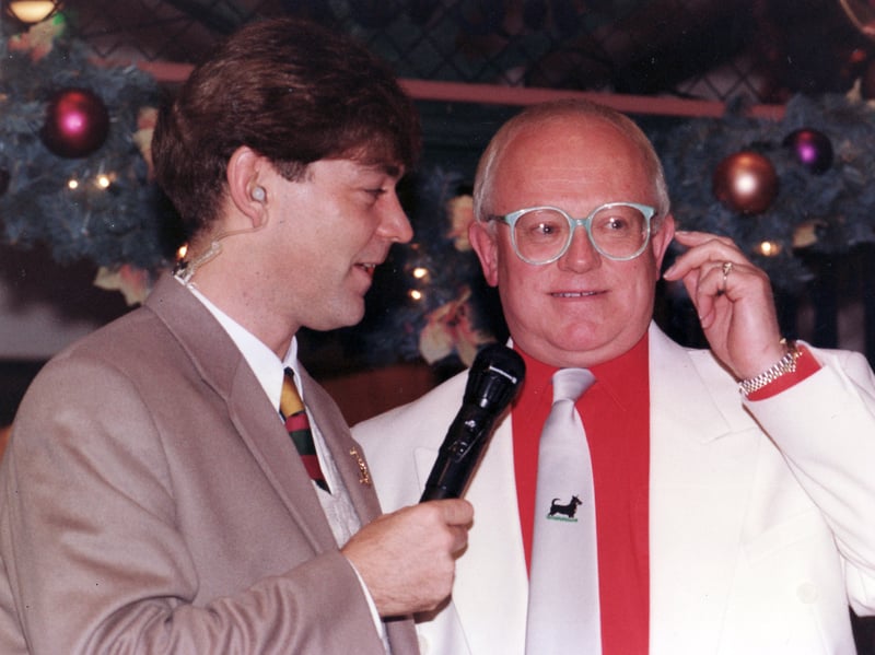 Coronation Street actor Ken Morley, who played Reg Holdsworth, is pictured during the Christmas lights switch-on at Meadowhall on October 30, 1994, with DJ Steve Colman