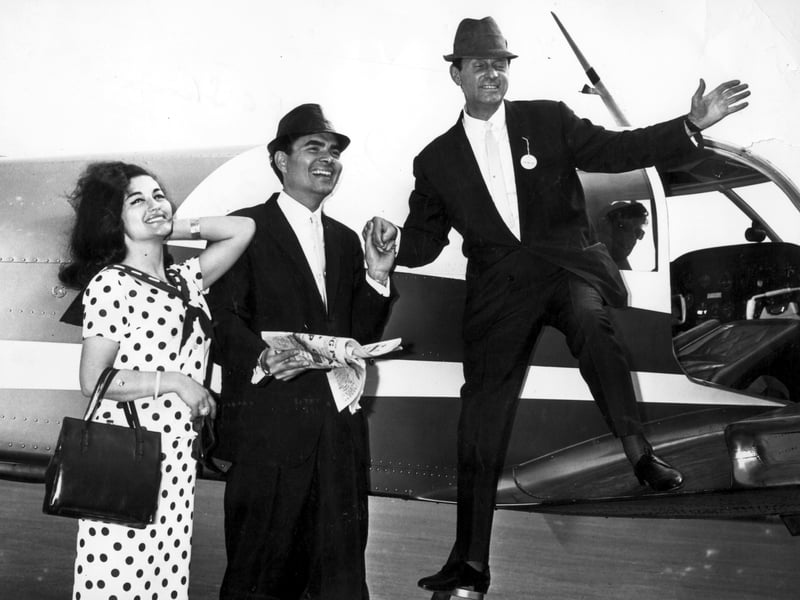 Comic Al Read steps out of his chartered plane at Squires Gate after a trip to York races in 1964. With him are singers Marlane Marcel and Dick Francis from the Central Pier Show, 1964