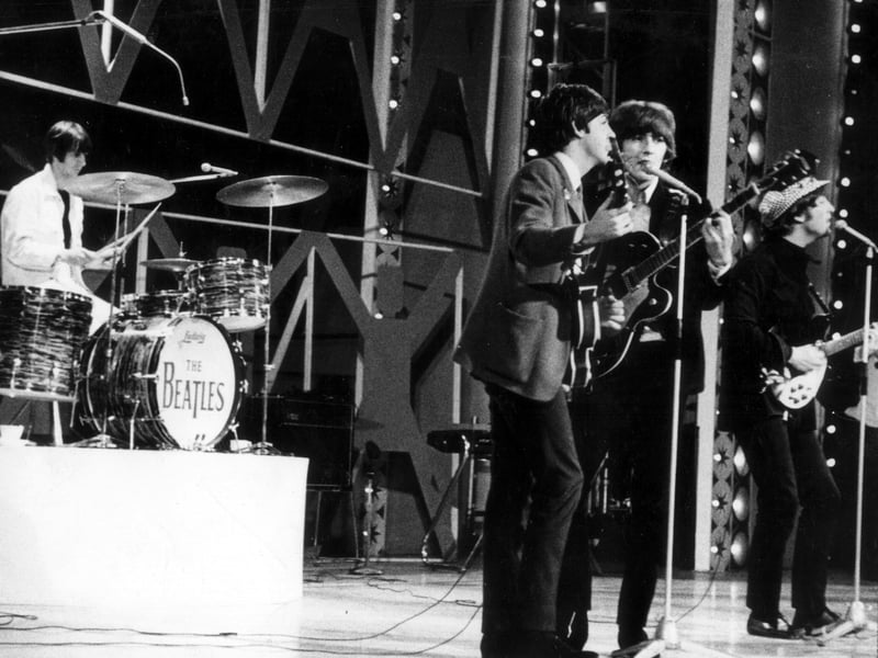 The Beatles on the stage of the ABC Theatre which opened in May 1963. They played live Sunday night TV concerts there including the debut of "Yesterday" by Paul McCartney on 1st August 1965 . The world's most recorded song was sung solo to the backing of his own acoustic guitar