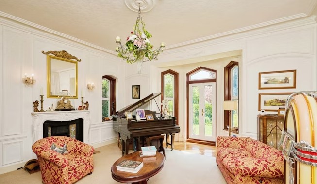 The listing says: "There are an abundance of features to admire, including high chimney stacks, high coved ceilings, picture / dado rails, original wooden doors and impressive fireplaces." 