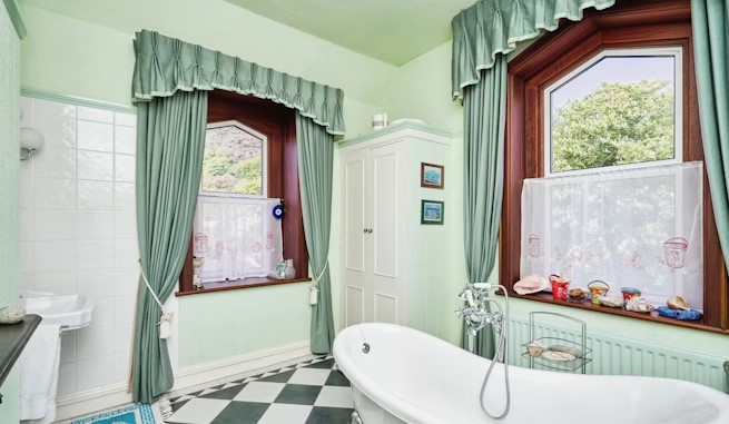 The listing says: "Arranged over three levels, the main residence briefly consists of three generously sized reception rooms on the ground floor level as well as the kitchen."