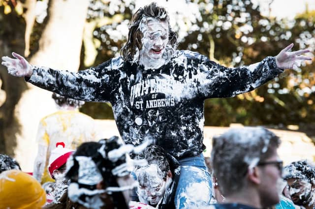 University of St Andrews students take part in the annual Raisin Monday Shaving Foam Fight. They are the happiest students in Scotland, according to a recent report.